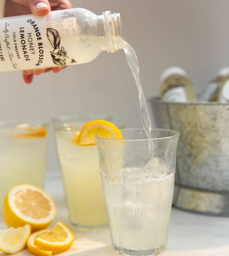 apricot lane farms lemonade pouring into glass
